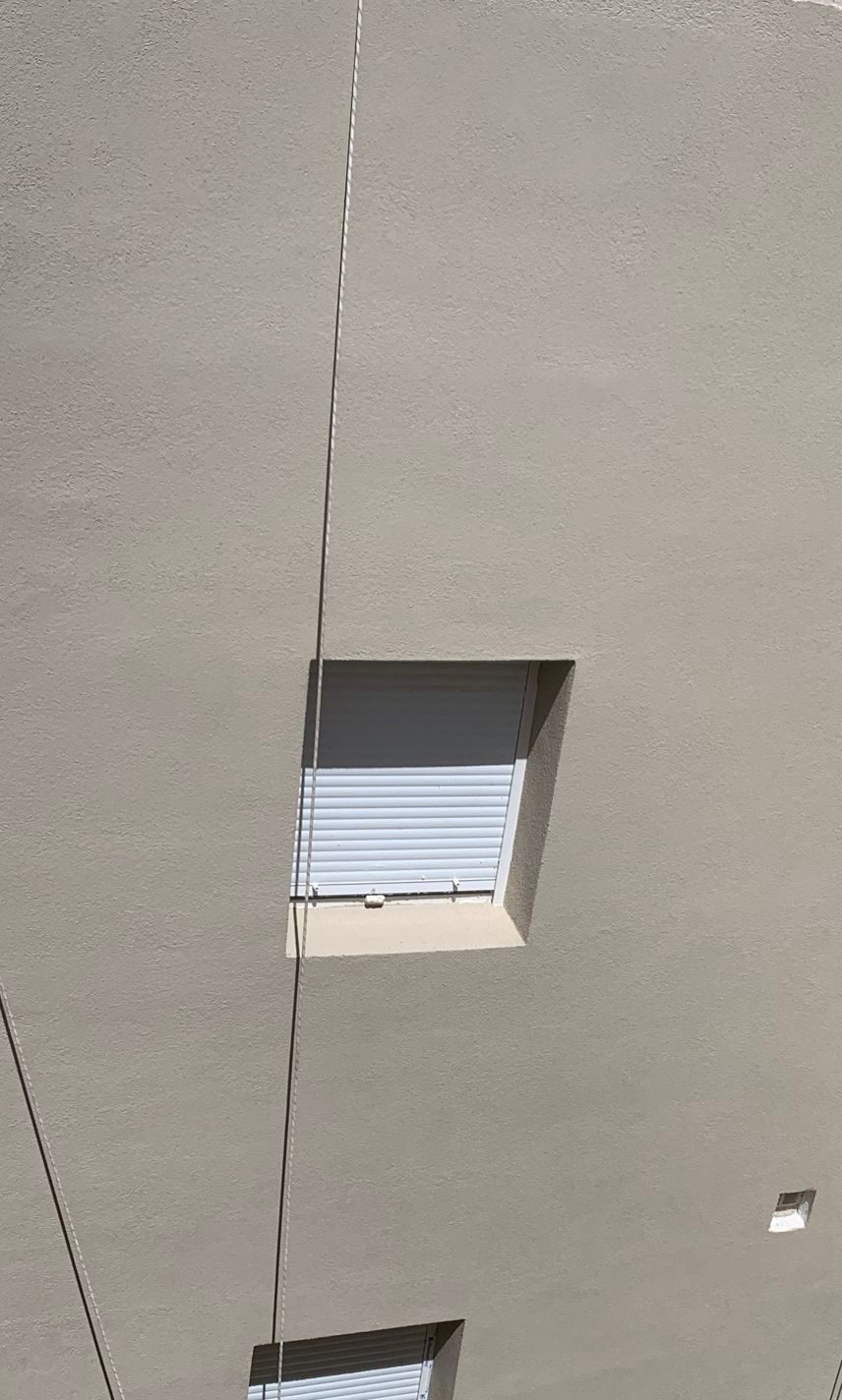 Detalle de fachada acabada con SATE